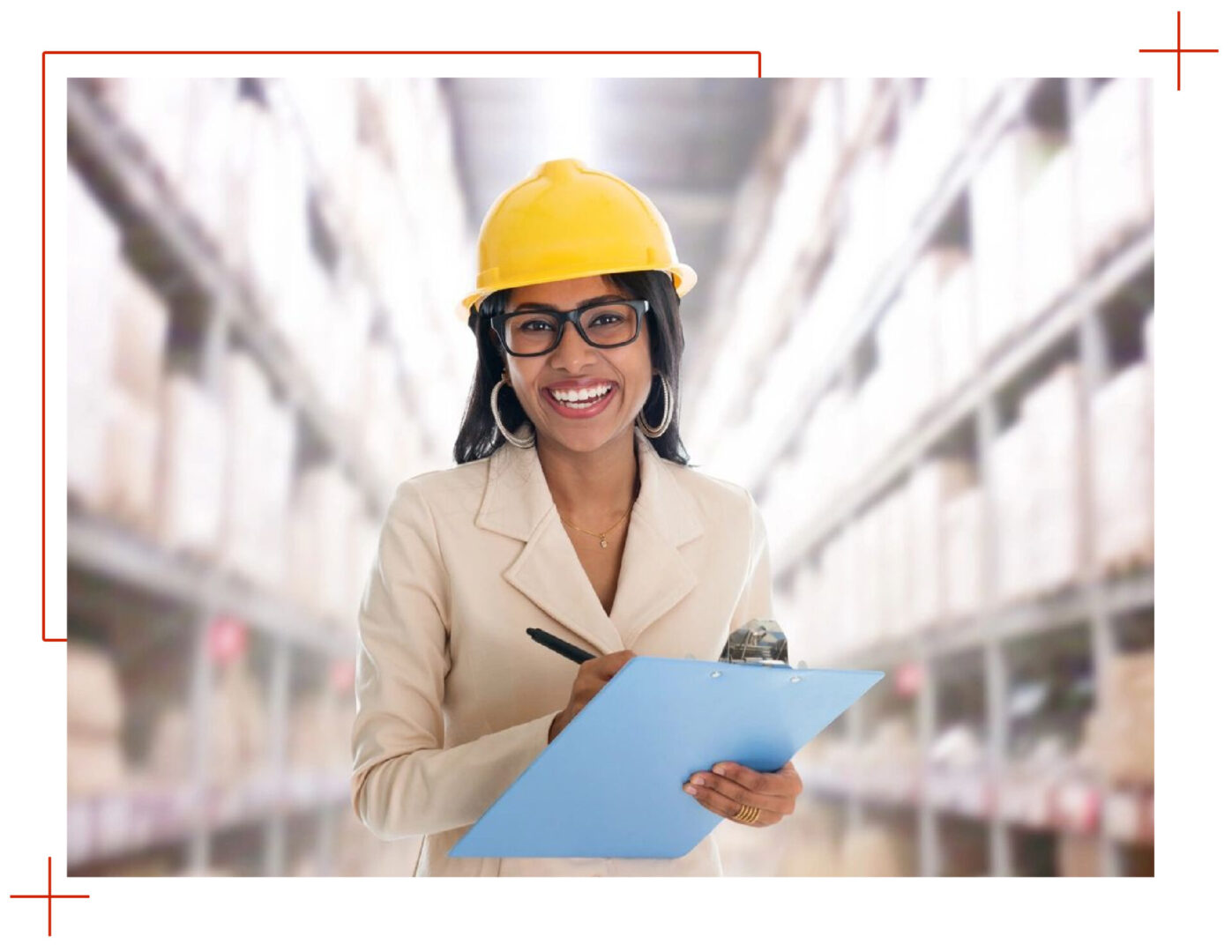 A woman in a hard hat holding a clipboard.