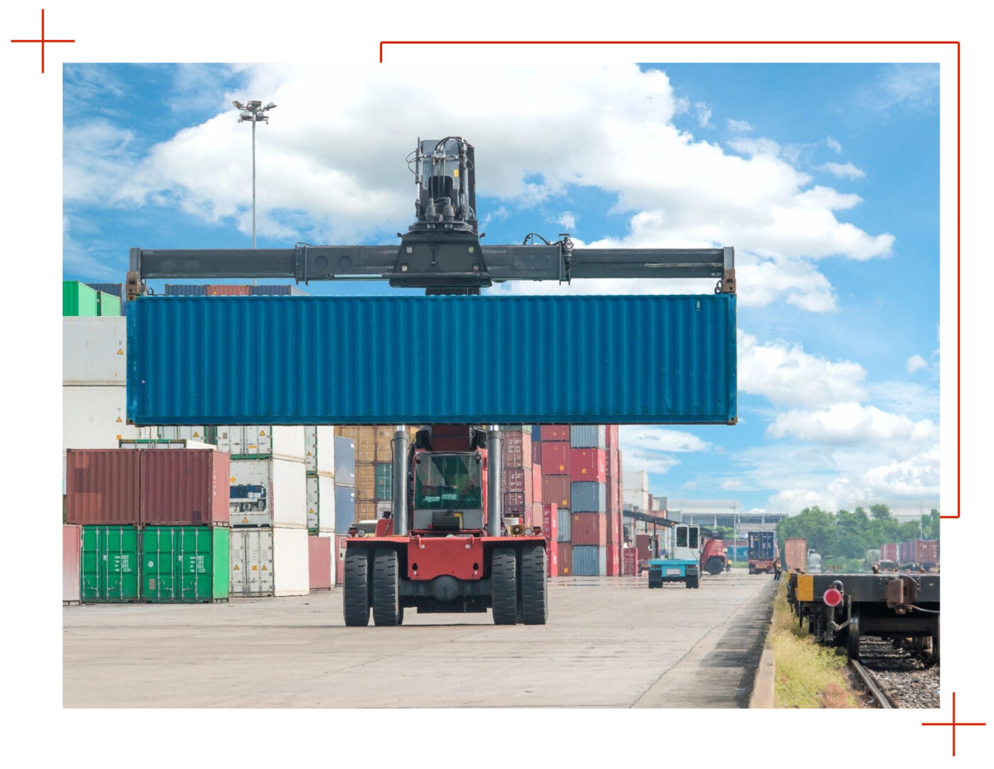 A large crane lifting a container on top of it.