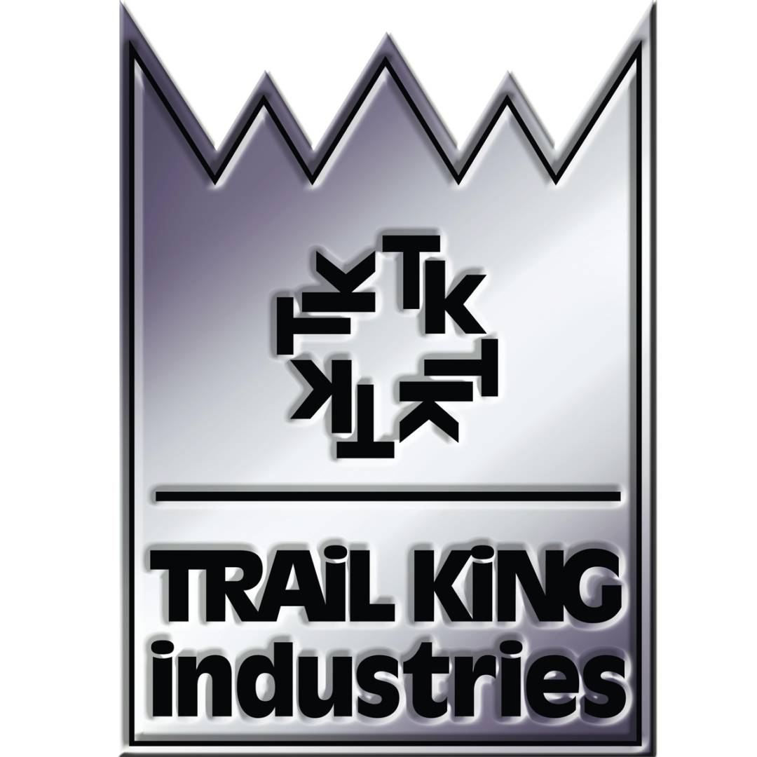 A silver badge with the words trail king industries written in it.